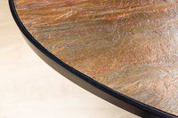 MOUNTAIN SOUL Massiver Esstisch 240cm rötlich grün schwarz oval Naturstein Eisen