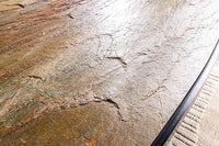 MOUNTAIN SOUL Massiver Esstisch 240cm rötlich grün schwarz oval Naturstein Eisen