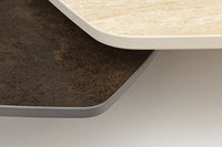 MOVEMENT Design Couchtisch rost fünfeckig drehbar Travertin Keramik schwarz Metall